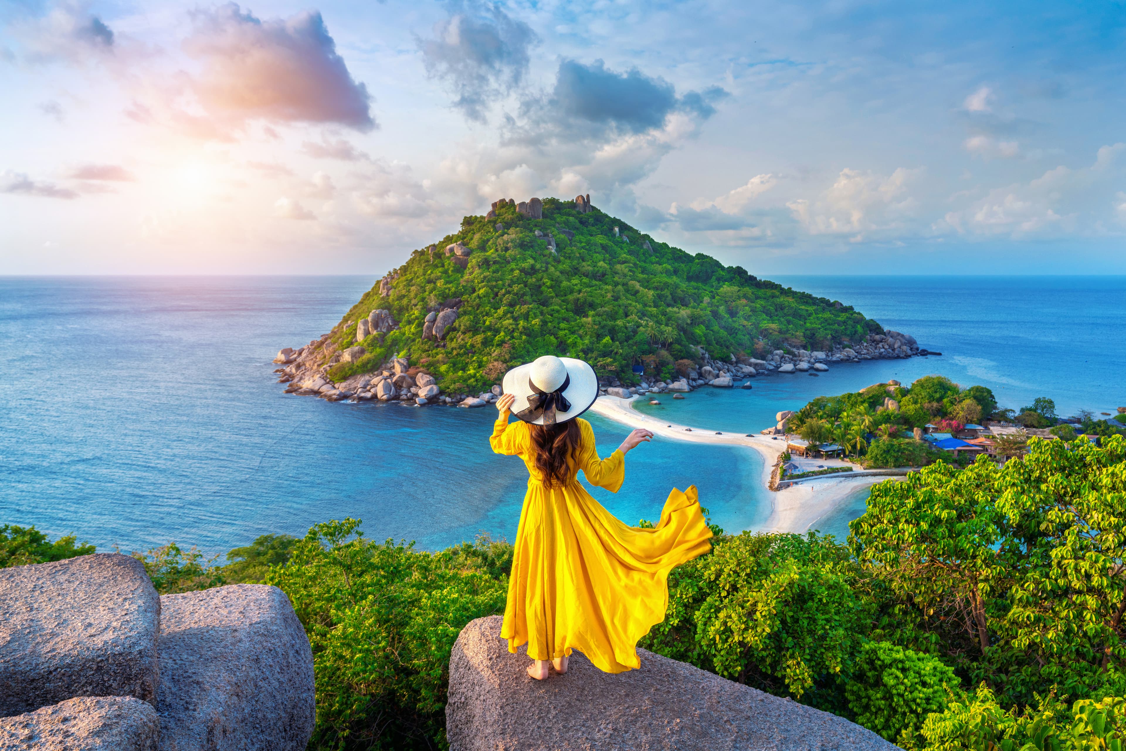 Traveler overlooking a tropical island